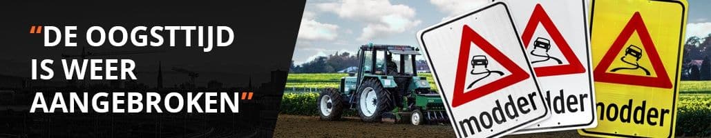 Paar modderborden en een boer op een trekker